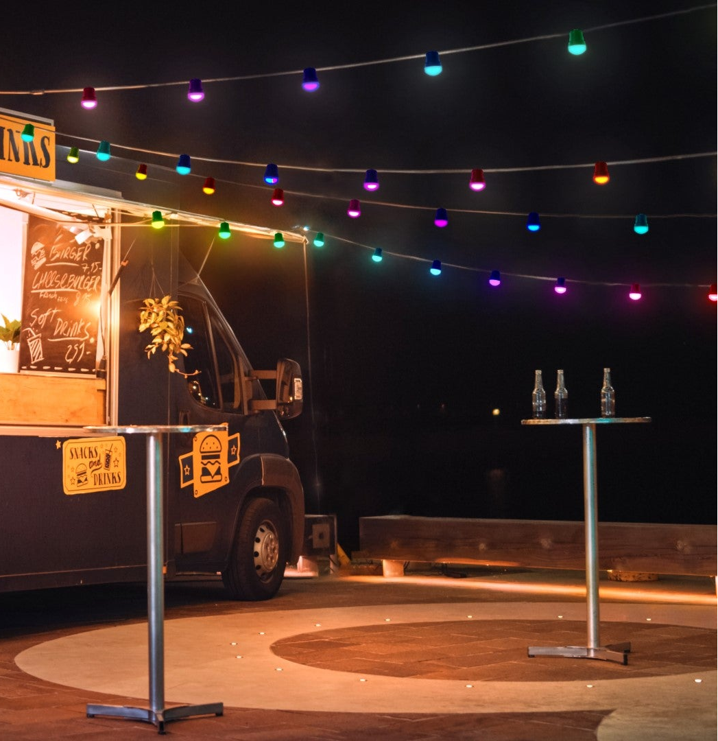 Food truck with string lights at night